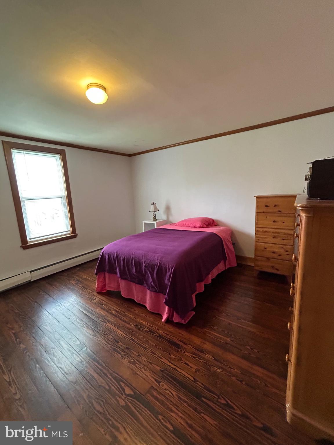 56 Maclay Street Milroy, PA 17063 - Photo 25 of 36 Cozy bedroom with warm wooden floors.