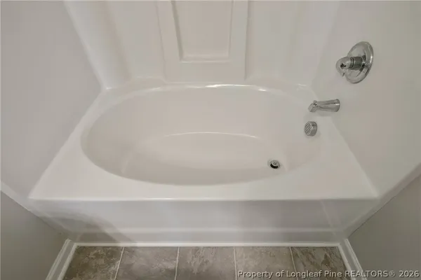 a close view of a bathtub in bathroom