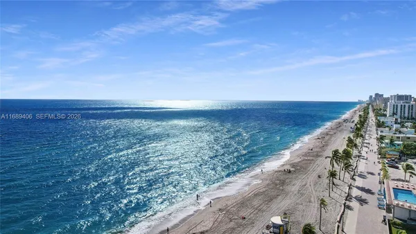 an aerial view of beach and ocean