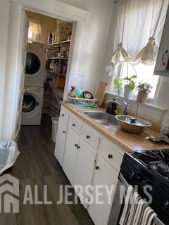 78 Center Street, Unit 2 Perth Amboy, NJ 08861 - Photo 4 of 8 a kitchen with a refrigerator and a stove