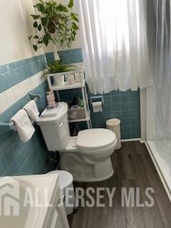 78 Center Street, Unit 2 Perth Amboy, NJ 08861 - Photo 7 of 8 a bathroom with a toilet a sink and a shower