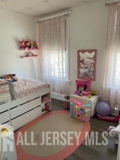 78 Center Street, Unit 2 Perth Amboy, NJ 08861 - Photo 8 of 8 a bedroom with a bed and window