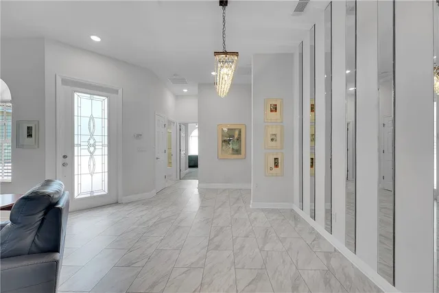 a kitchen with stainless steel appliances granite countertop a refrigerator stove microwave and sink