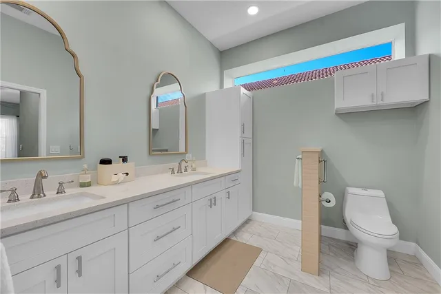 a bed room with a bed and a chandelier