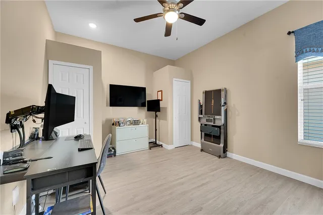 a room with furniture and a flat screen tv