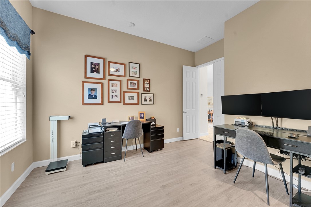 715 Southwest Munjack Circle Port St. Lucie, FL 34986 - Photo 23 of 36 a room with furniture and a flat screen tv