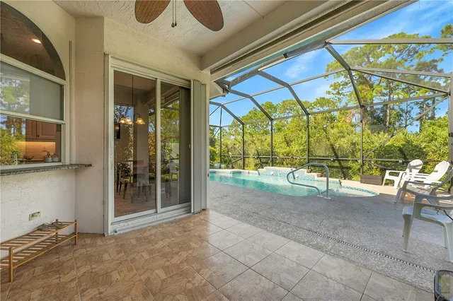 a view of a swimming pool with a patio