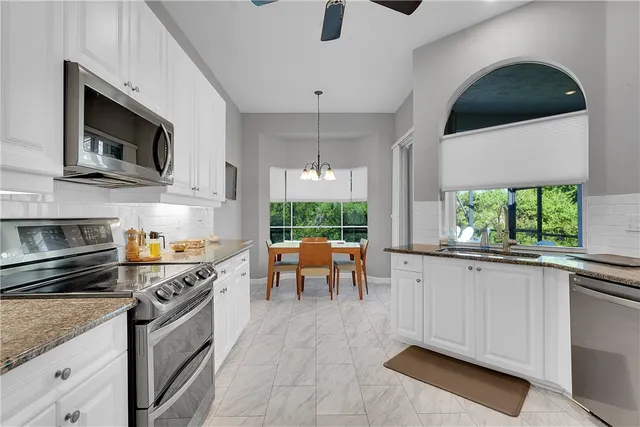a bathroom with a double vanity sink and mirror