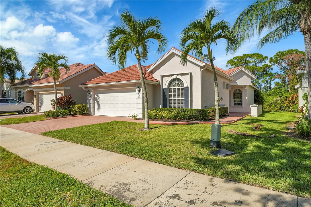 715 Southwest Munjack Circle Port St. Lucie, FL 34986 - Photo 7 of 36 a front view of house with yard and green space
