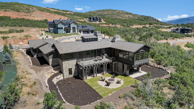 2192 East Outlaw Road Kamas, UT 84036 - Photo 79 of 80 Modern mountain-style exterior with stone and wood siding, multiple rooflines, and an expansive upper-level deck