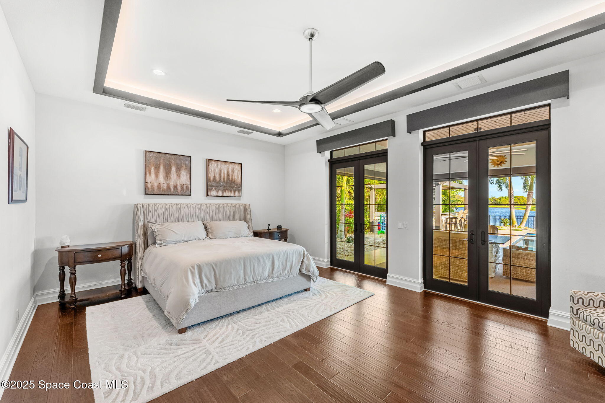 4655 Tea Tree Court Rockledge, FL 32955 - Photo 13 of 58 a spacious bedroom with a large bed and a large window