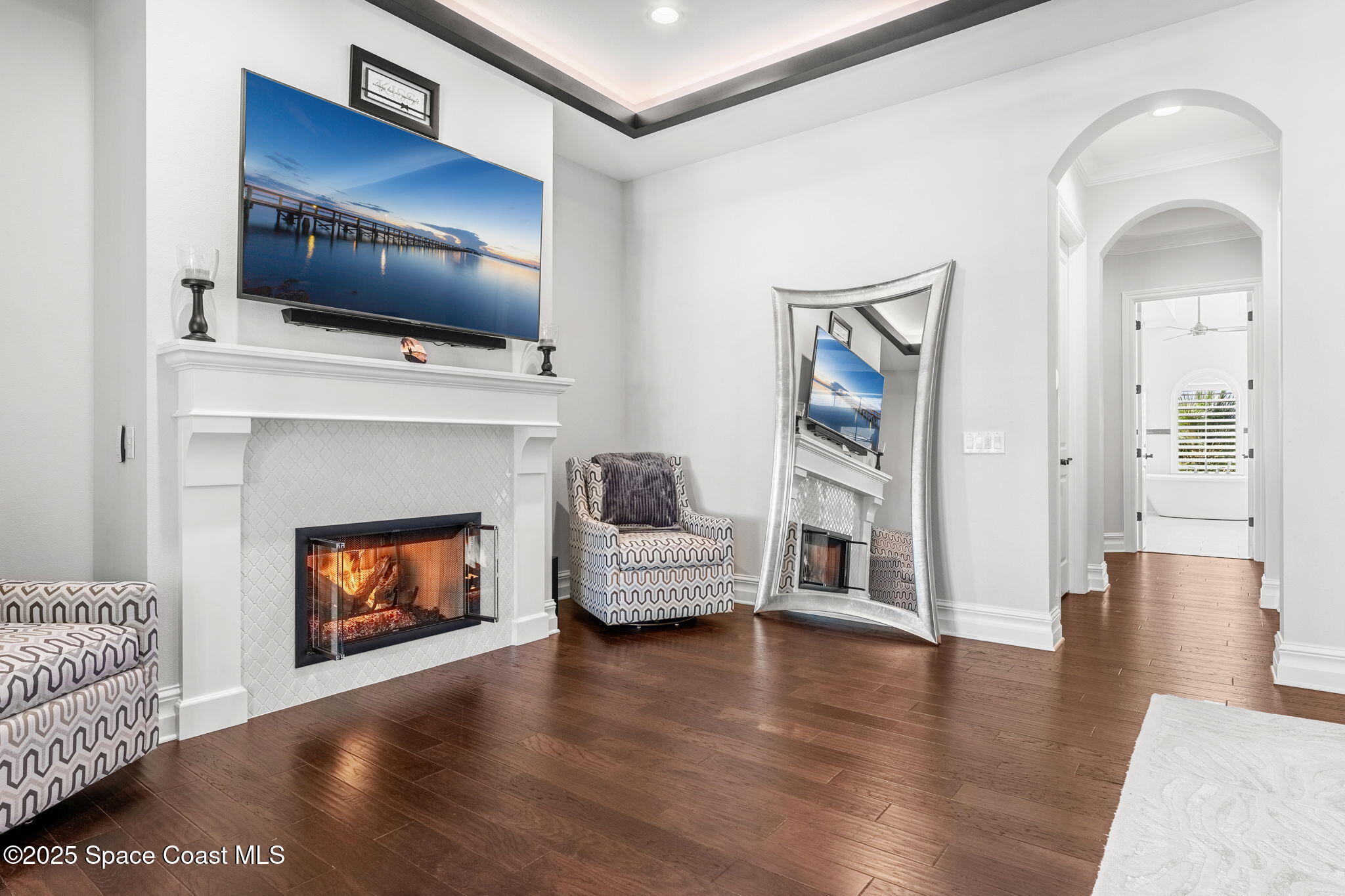 4655 Tea Tree Court Rockledge, FL 32955 - Photo 14 of 58 a living room with furniture fireplace and flat screen tv