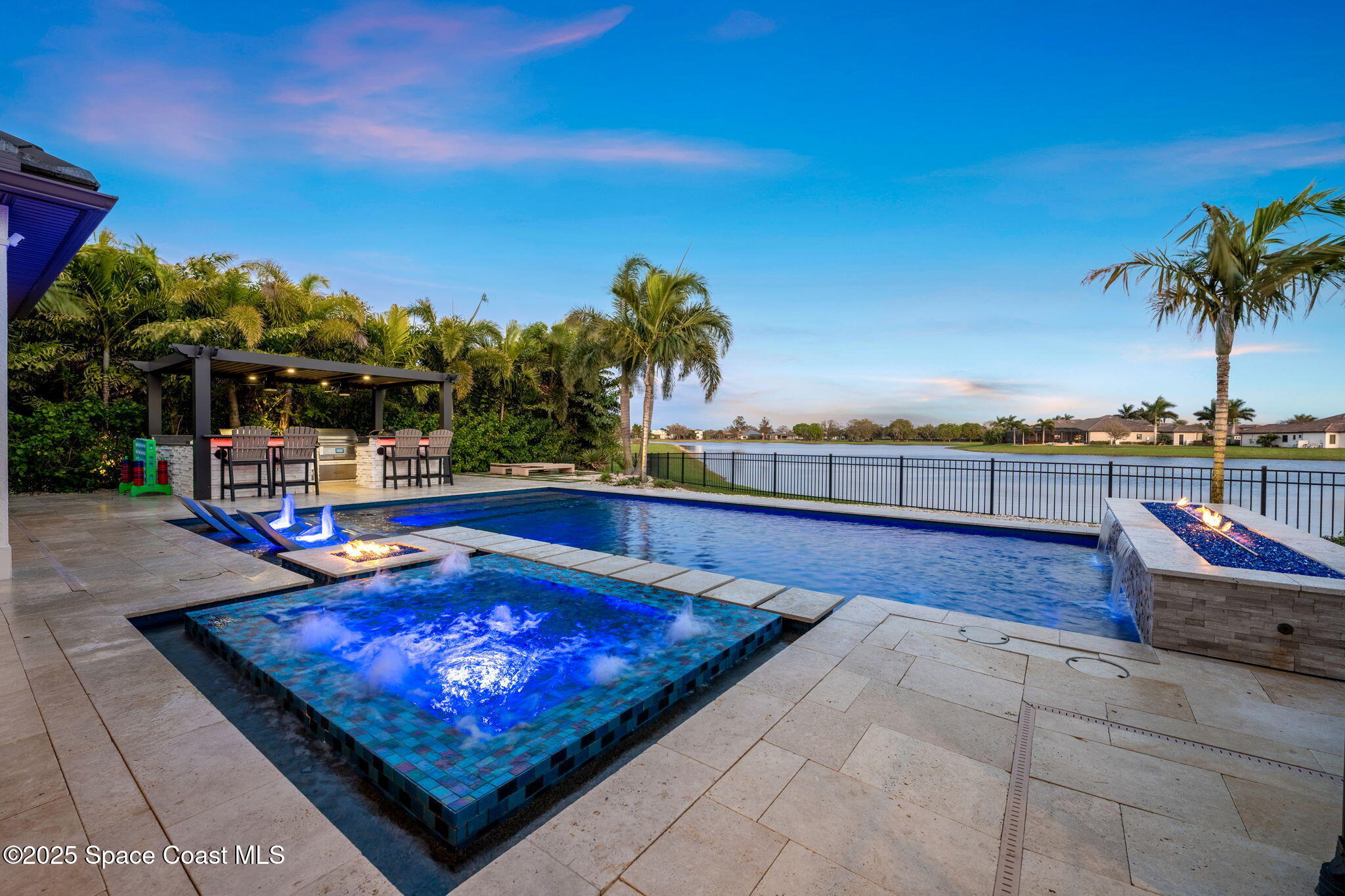 4655 Tea Tree Court Rockledge, FL 32955 - Photo 19 of 58 a view of a swimming pool with a lounge chair