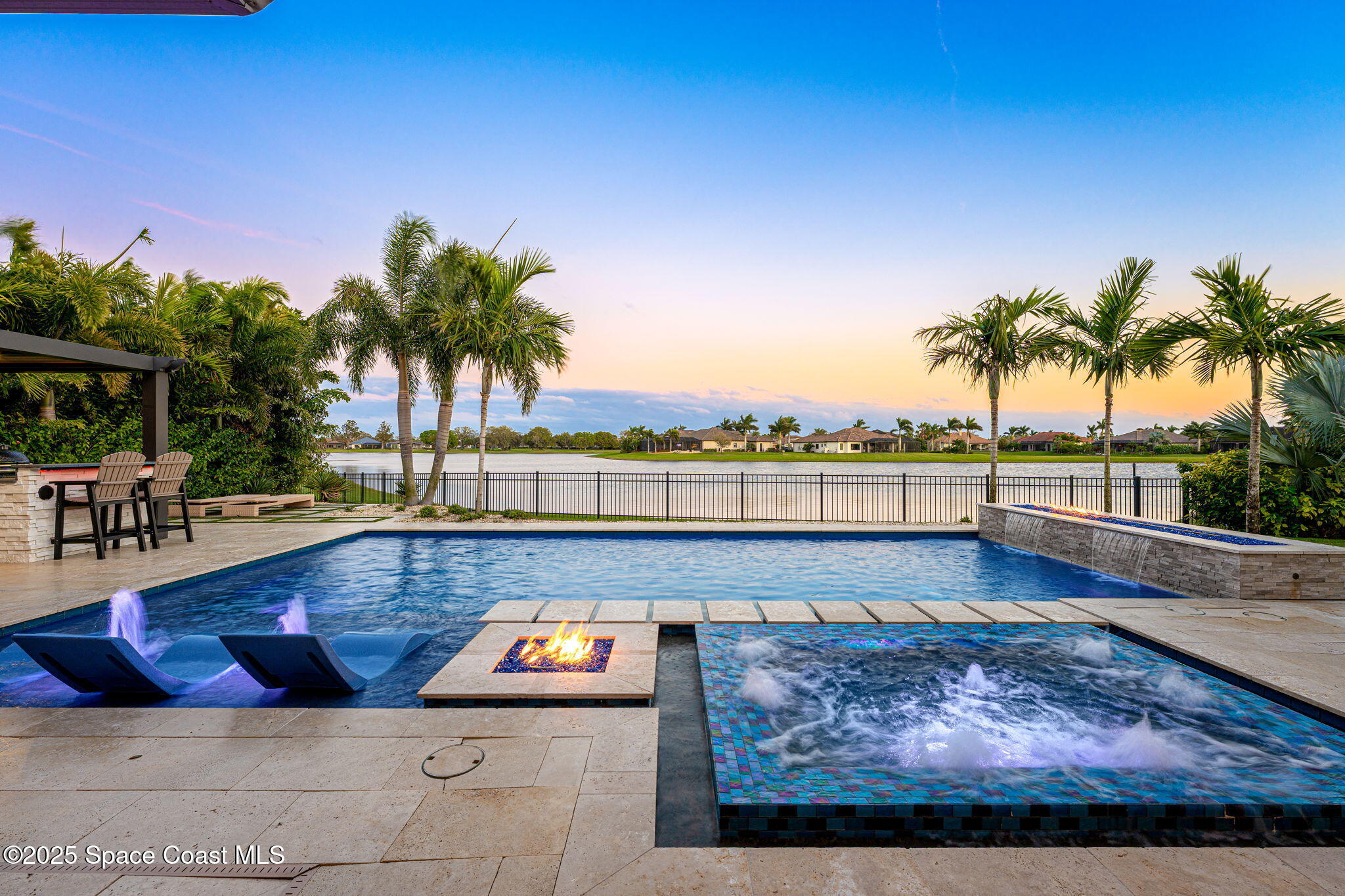 4655 Tea Tree Court Rockledge, FL 32955 - Photo 20 of 58 a view of swimming pool with outdoor seating and plants