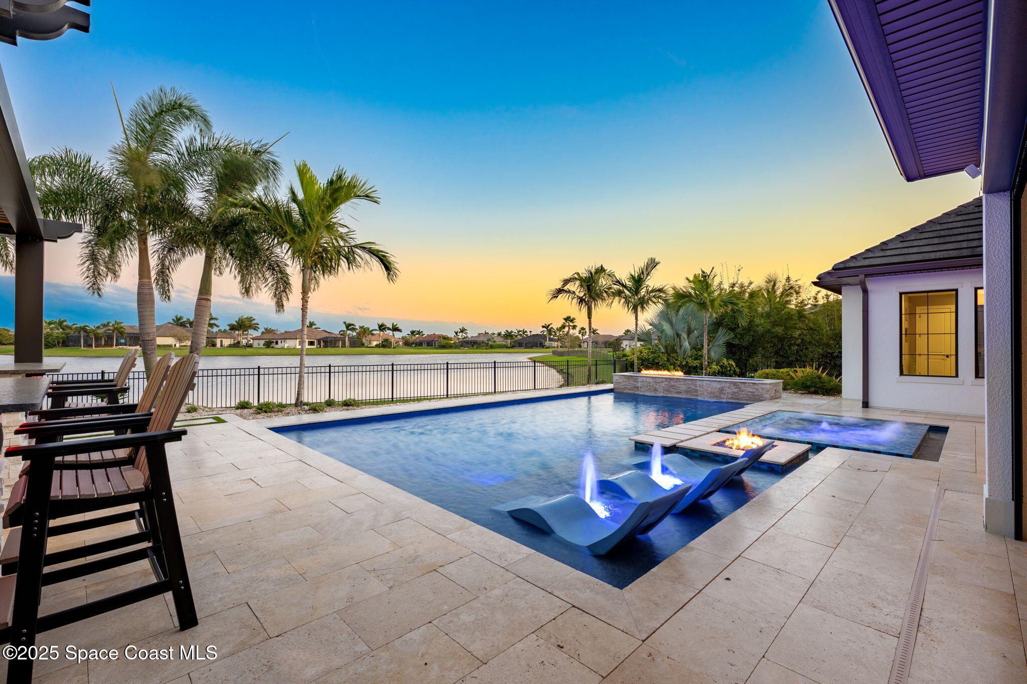 4655 Tea Tree Court Rockledge, FL 32955 - Photo 22 of 58 a view of swimming pool with chairs