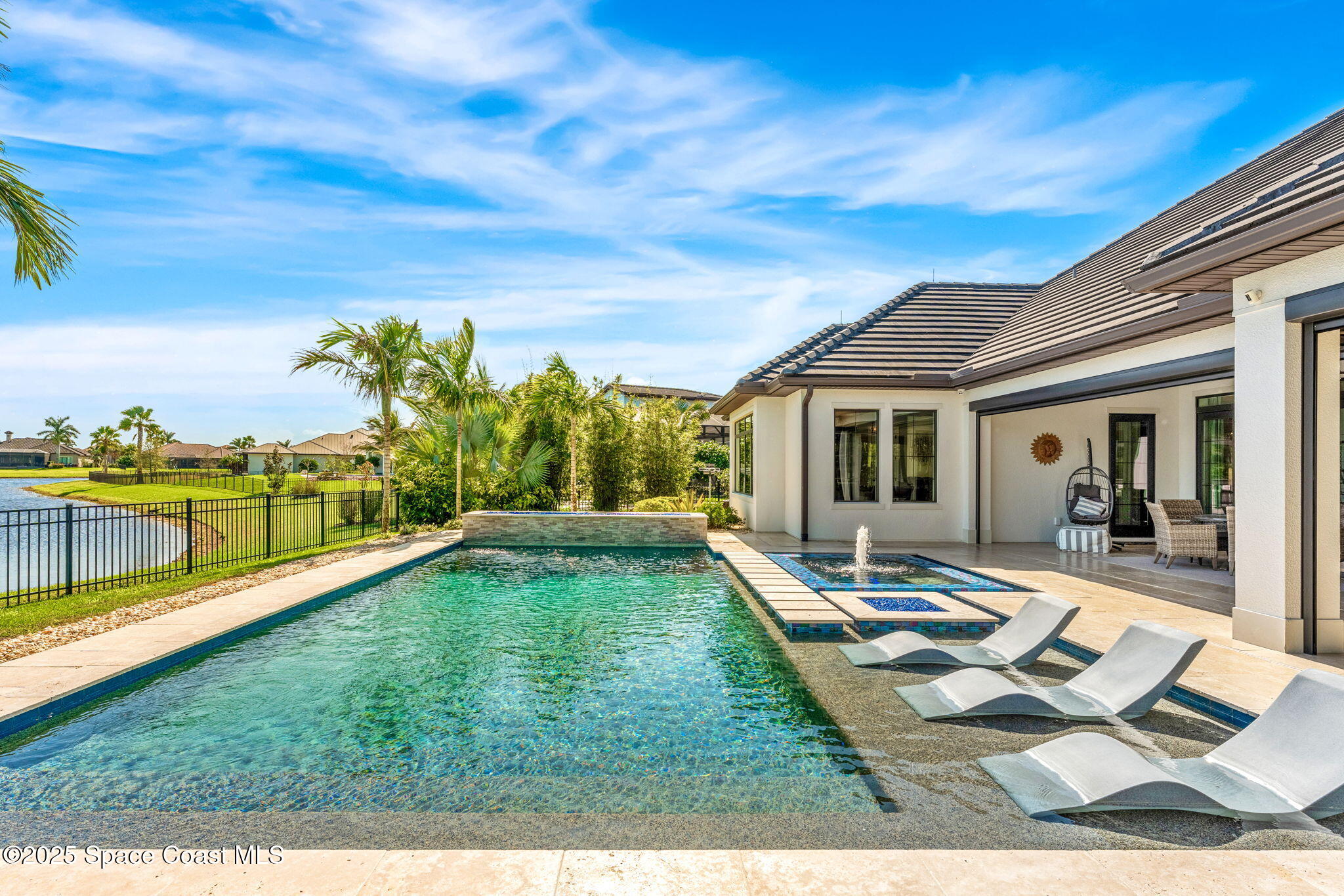 4655 Tea Tree Court Rockledge, FL 32955 - Photo 24 of 58 a view of a house with swimming pool and sitting area