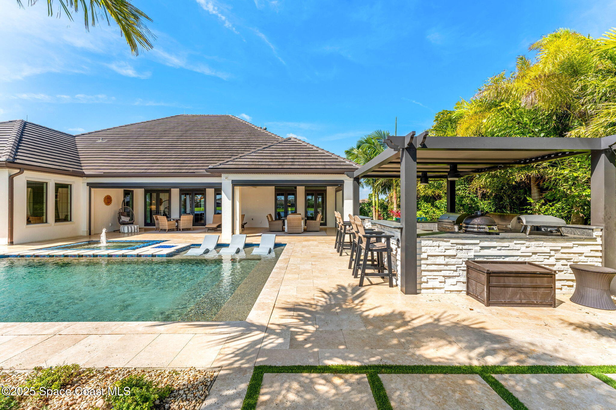 4655 Tea Tree Court Rockledge, FL 32955 - Photo 25 of 58 a view of a house with a swimming pool
