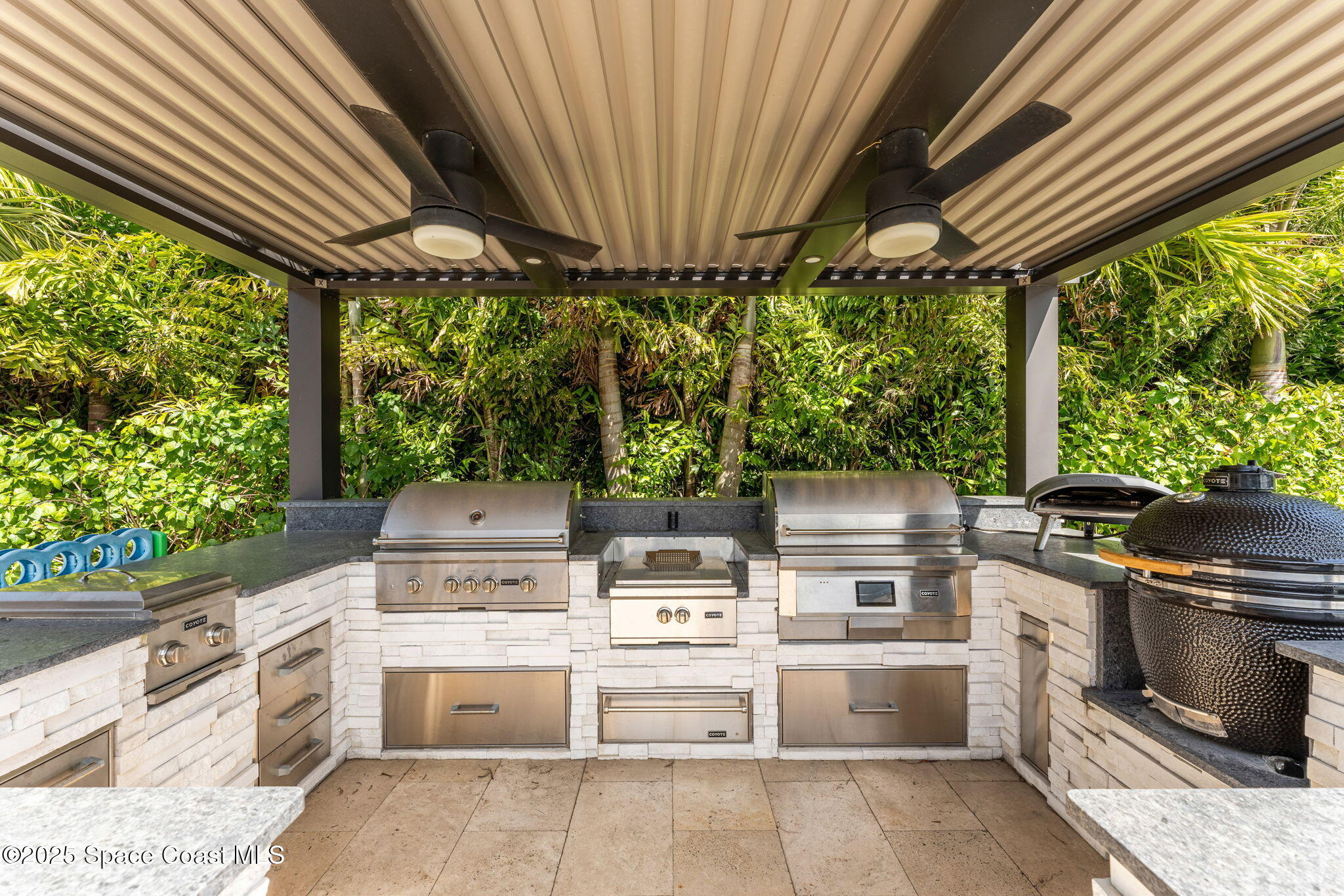 4655 Tea Tree Court Rockledge, FL 32955 - Photo 28 of 58 a open kitchen with stainless steel appliances granite countertop a stove a sink dishwasher and cabinets