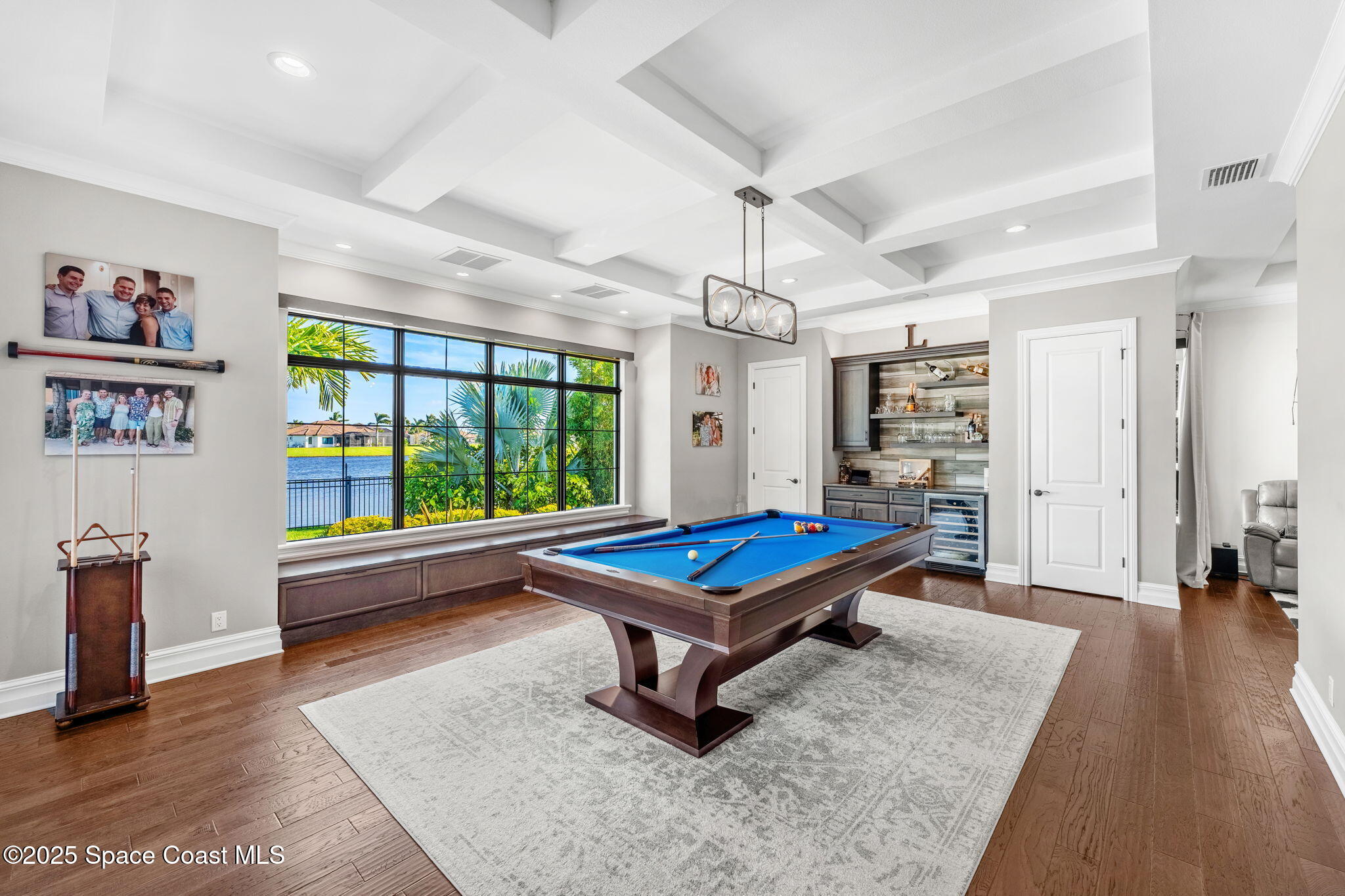 4655 Tea Tree Court Rockledge, FL 32955 - Photo 29 of 58 a room with lots of furniture and a large window