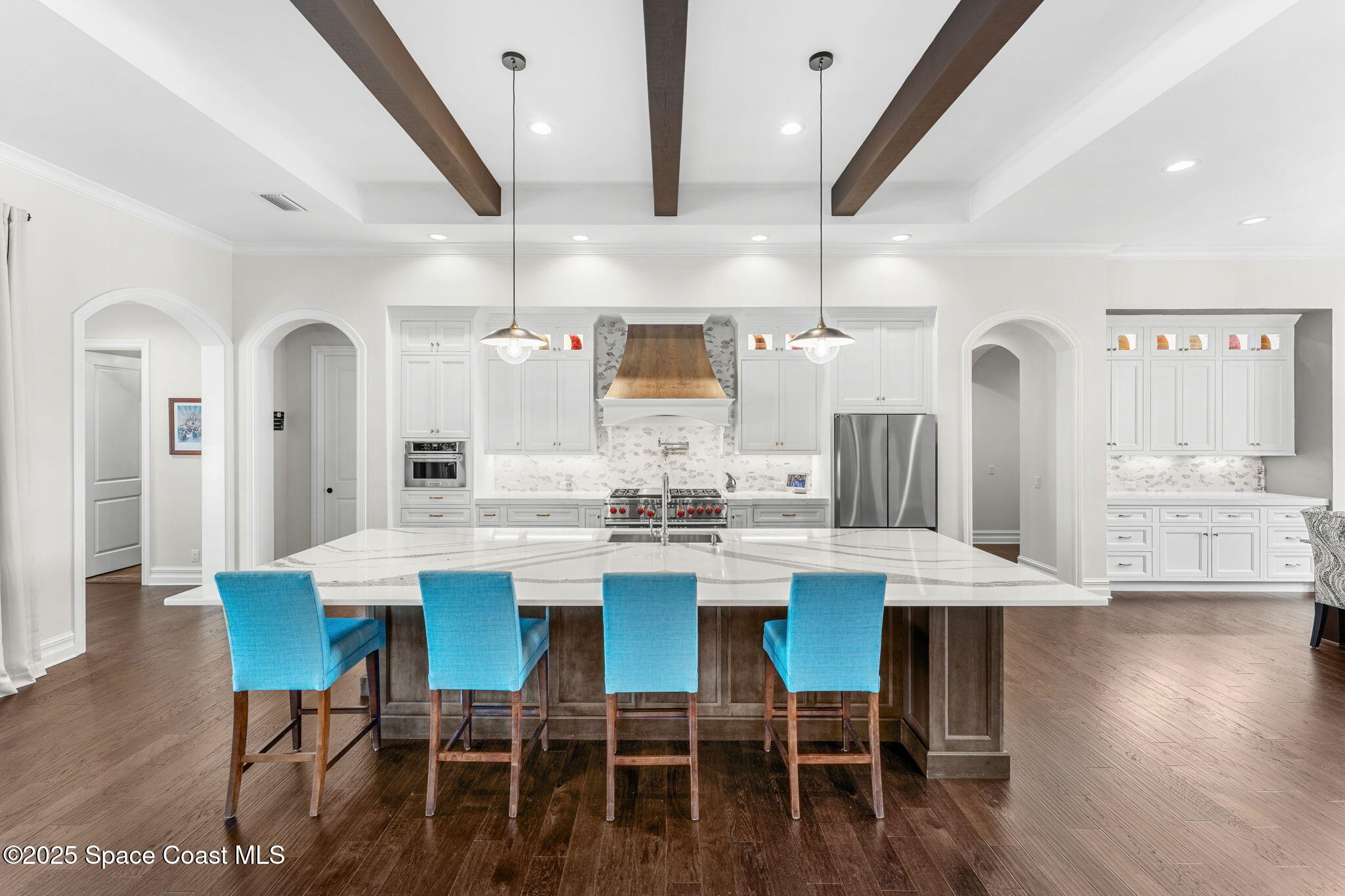 4655 Tea Tree Court Rockledge, FL 32955 - Photo 3 of 58 a view of a dining room with furniture and wooden floor