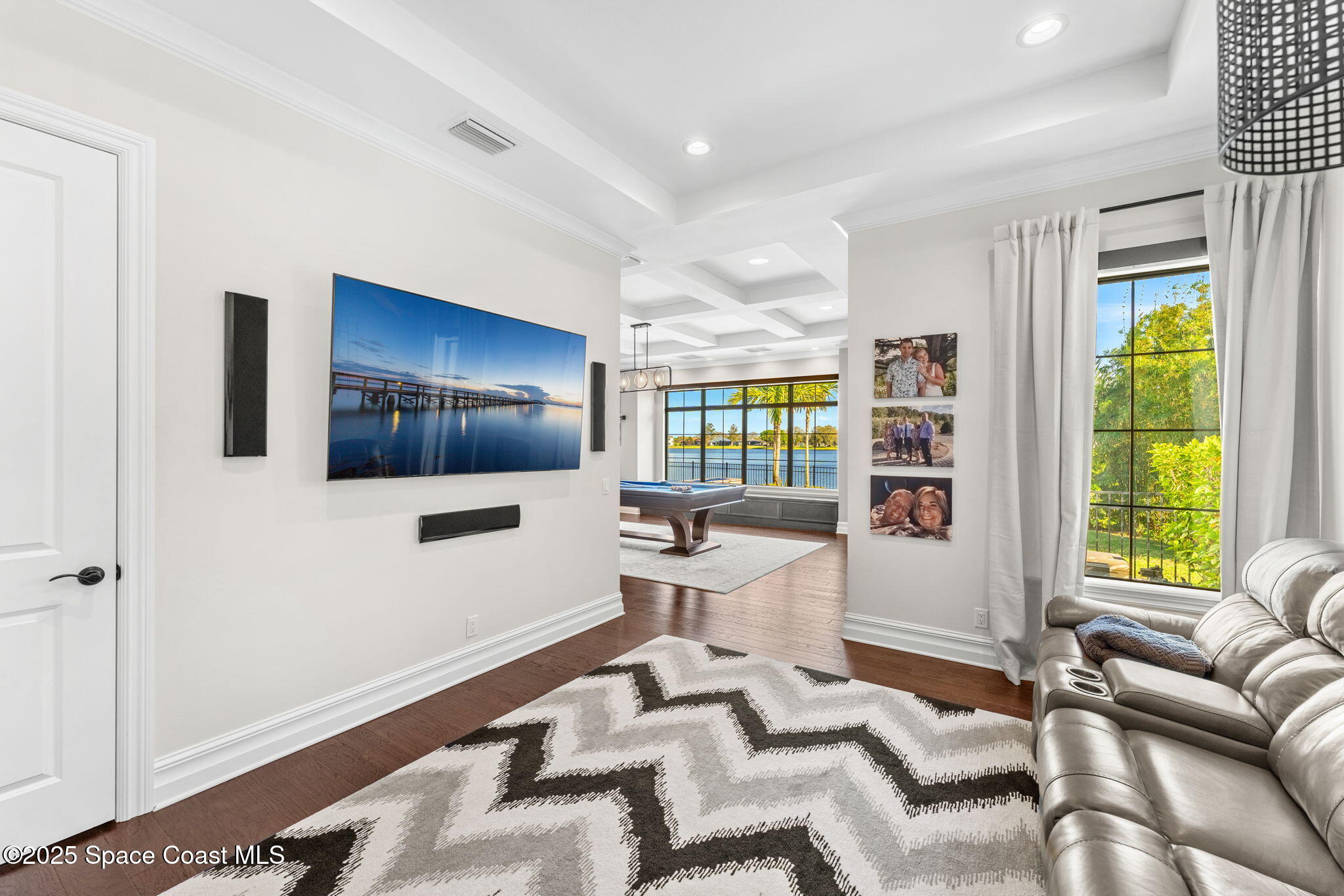 4655 Tea Tree Court Rockledge, FL 32955 - Photo 31 of 58 a living room with furniture and a flat screen tv