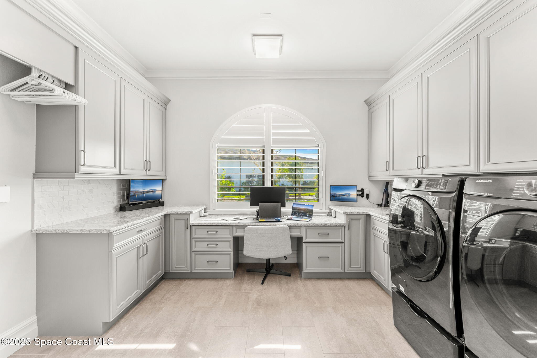 4655 Tea Tree Court Rockledge, FL 32955 - Photo 36 of 58 a view of a kitchen with a sink cabinets and a window