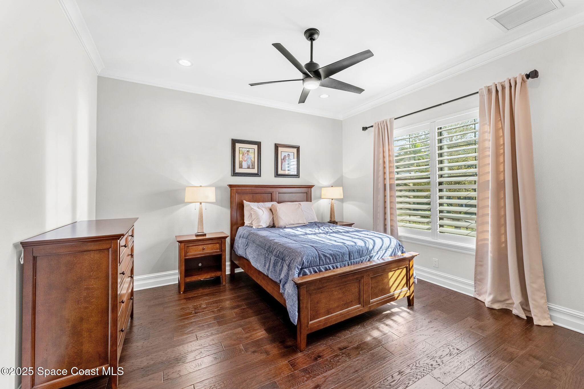 4655 Tea Tree Court Rockledge, FL 32955 - Photo 39 of 58 a bed sitting in a spacious bedroom next to a window