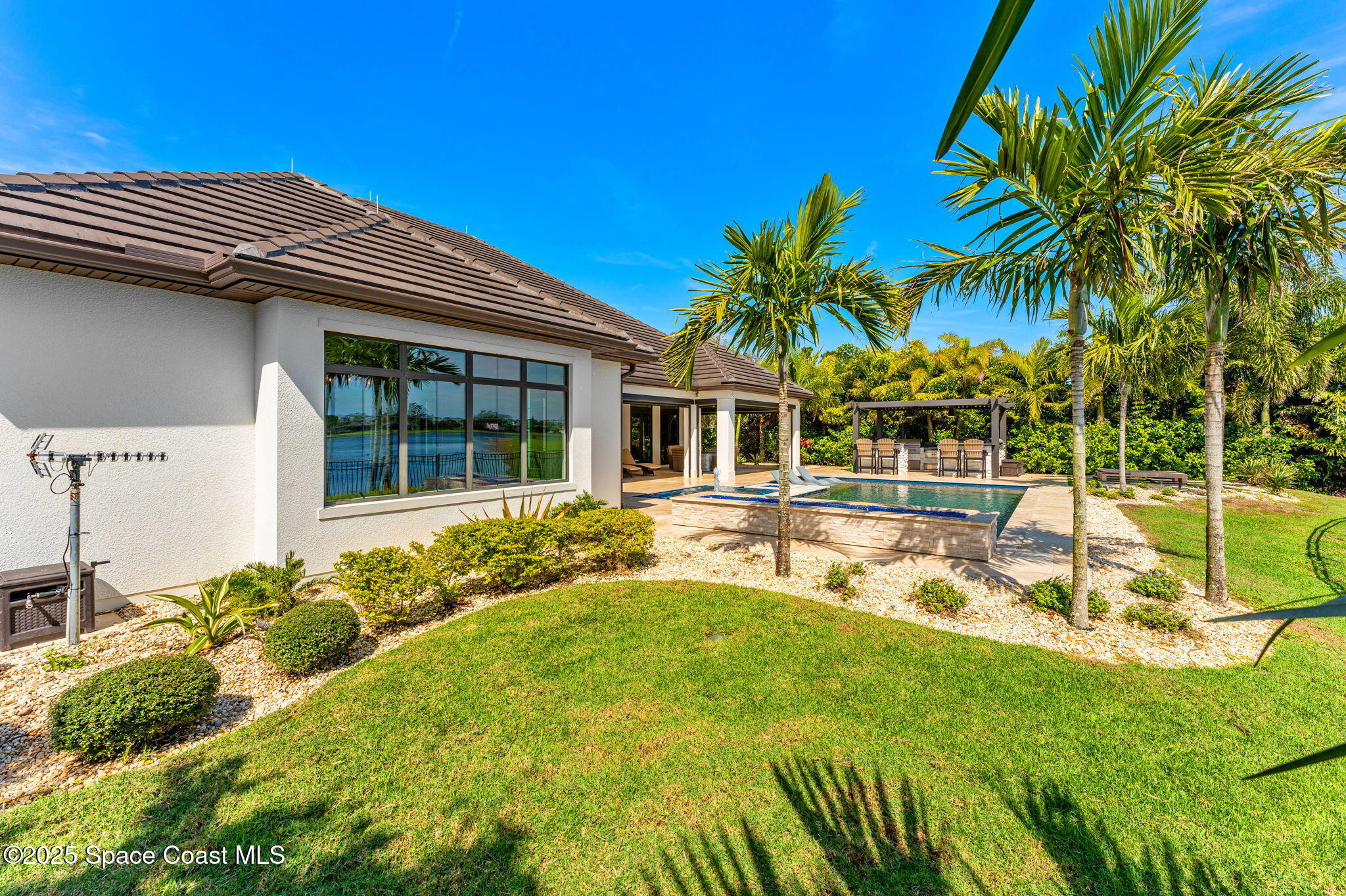 4655 Tea Tree Court Rockledge, FL 32955 - Photo 43 of 58 a view of a house with a patio
