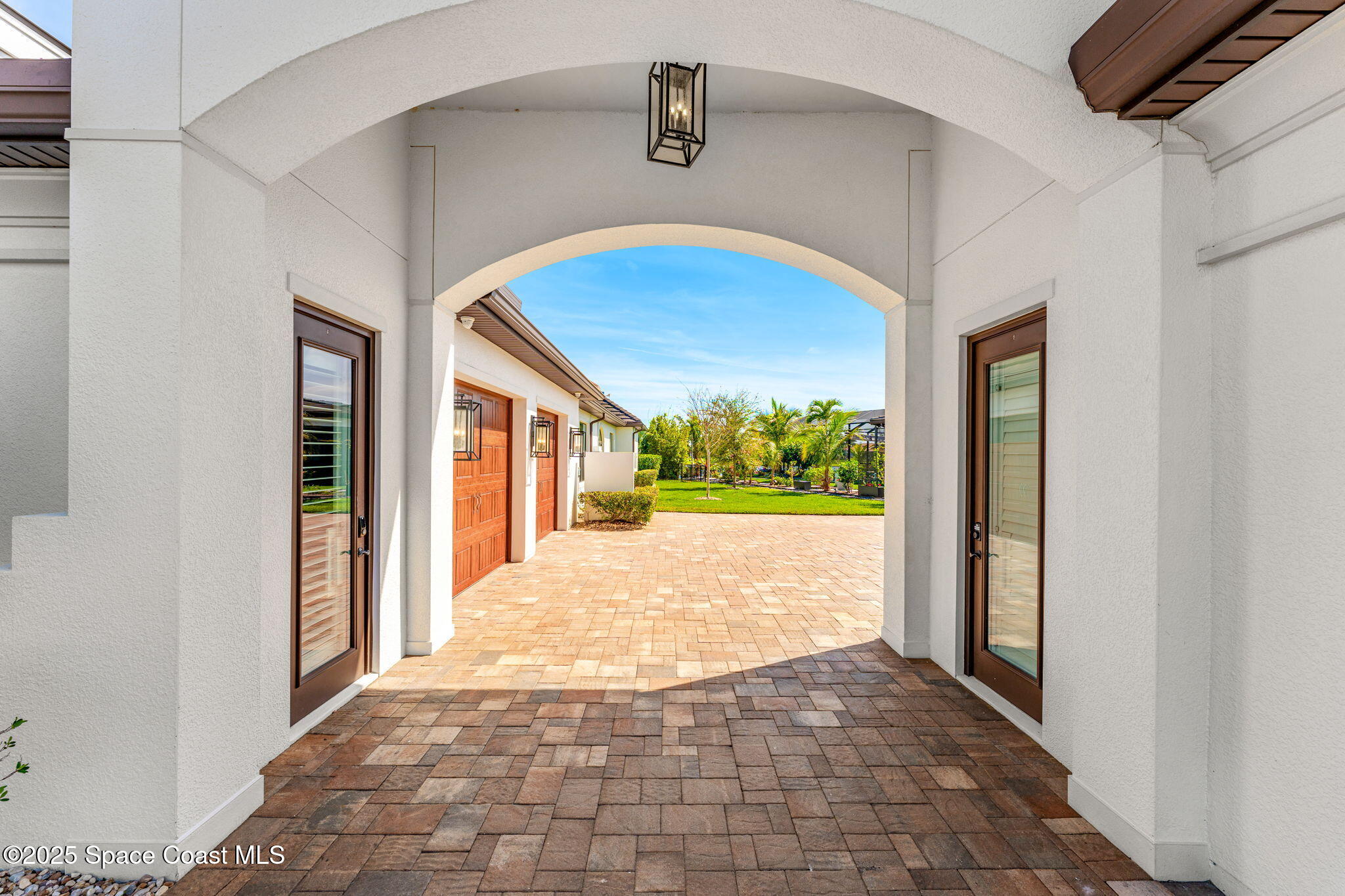 4655 Tea Tree Court Rockledge, FL 32955 - Photo 46 of 58 a view of a hallway to a livingroom with wooden floor and a window