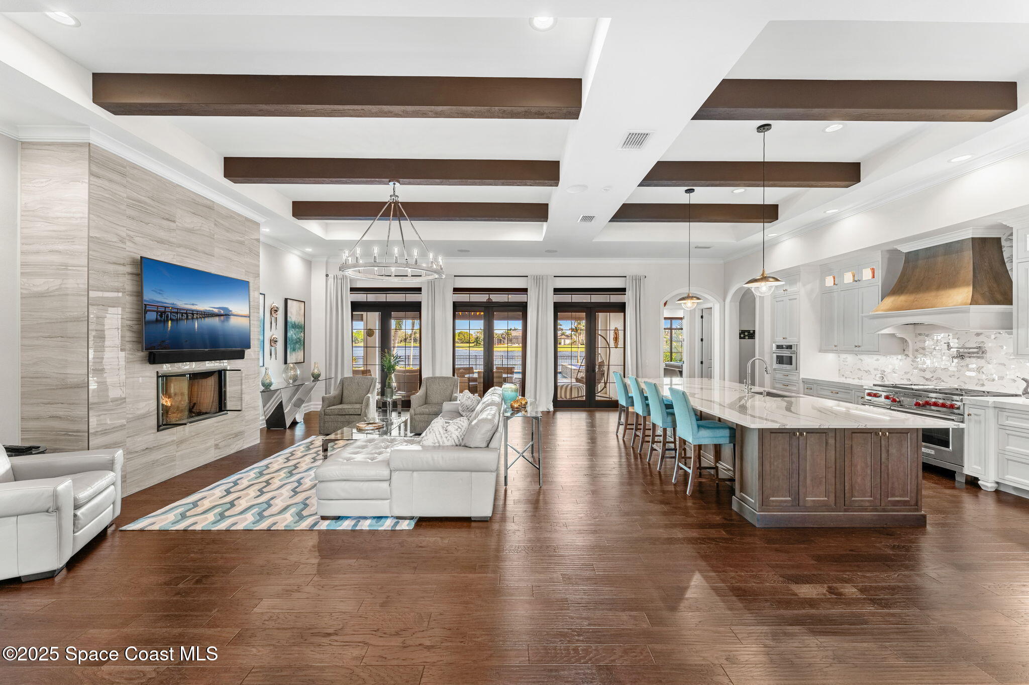 4655 Tea Tree Court Rockledge, FL 32955 - Photo 5 of 58 a living room with fireplace furniture and a flat screen tv