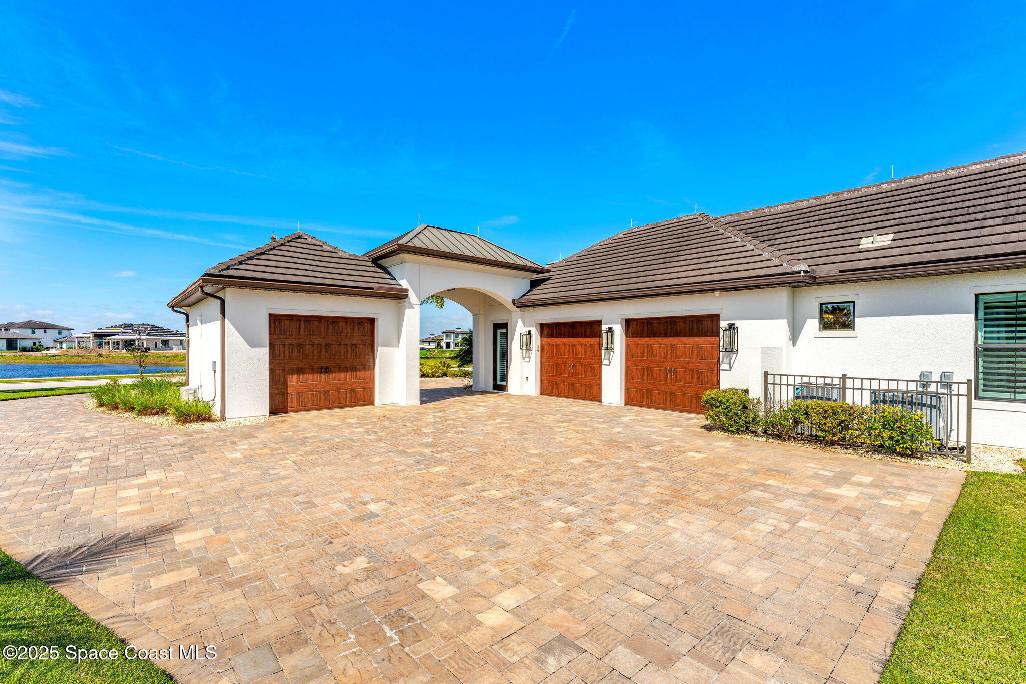 4655 Tea Tree Court Rockledge, FL 32955 - Photo 56 of 58 a front view of a house with a yard and garage