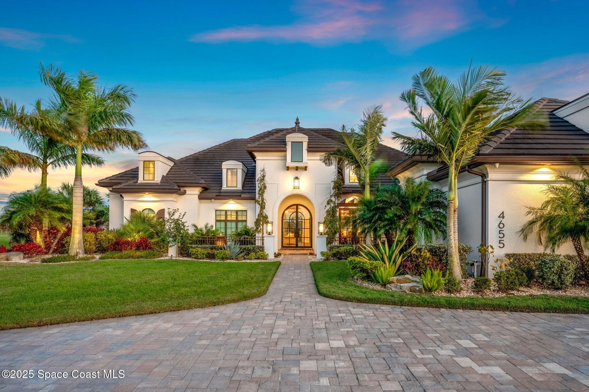 4655 Tea Tree Court Rockledge, FL 32955 - Photo 57 of 58 a front view of a house with a garden