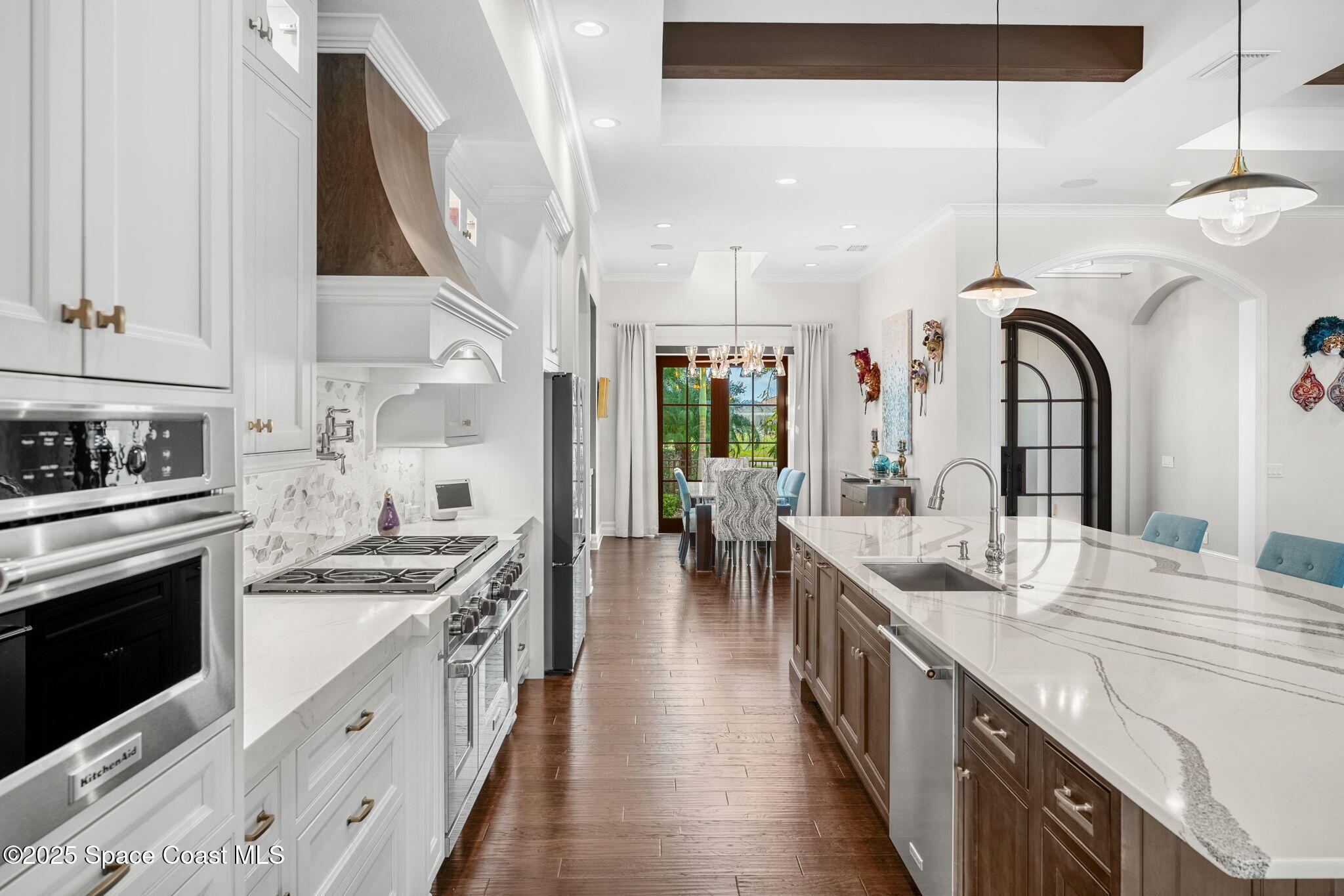 4655 Tea Tree Court Rockledge, FL 32955 - Photo 6 of 58 a kitchen with kitchen island granite countertop lots of counter top space and stainless steel appliances