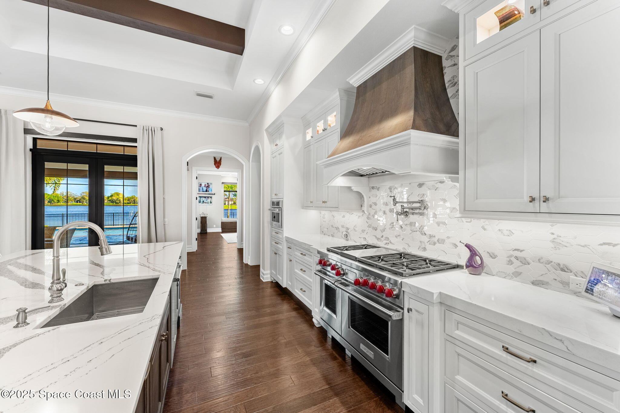 4655 Tea Tree Court Rockledge, FL 32955 - Photo 7 of 58 a kitchen with stainless steel appliances a stove a sink and cabinets
