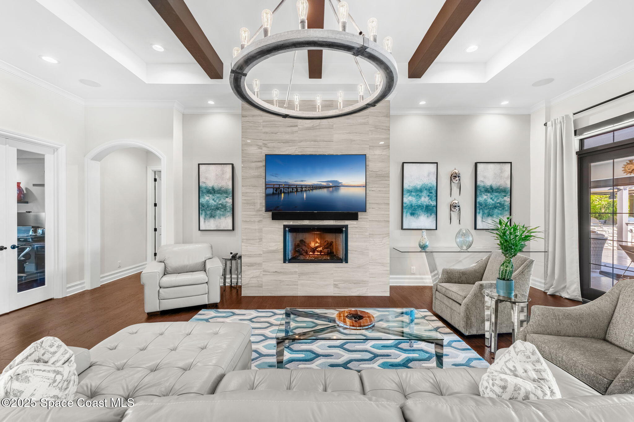 4655 Tea Tree Court Rockledge, FL 32955 - Photo 8 of 58 a living room with furniture and a fireplace