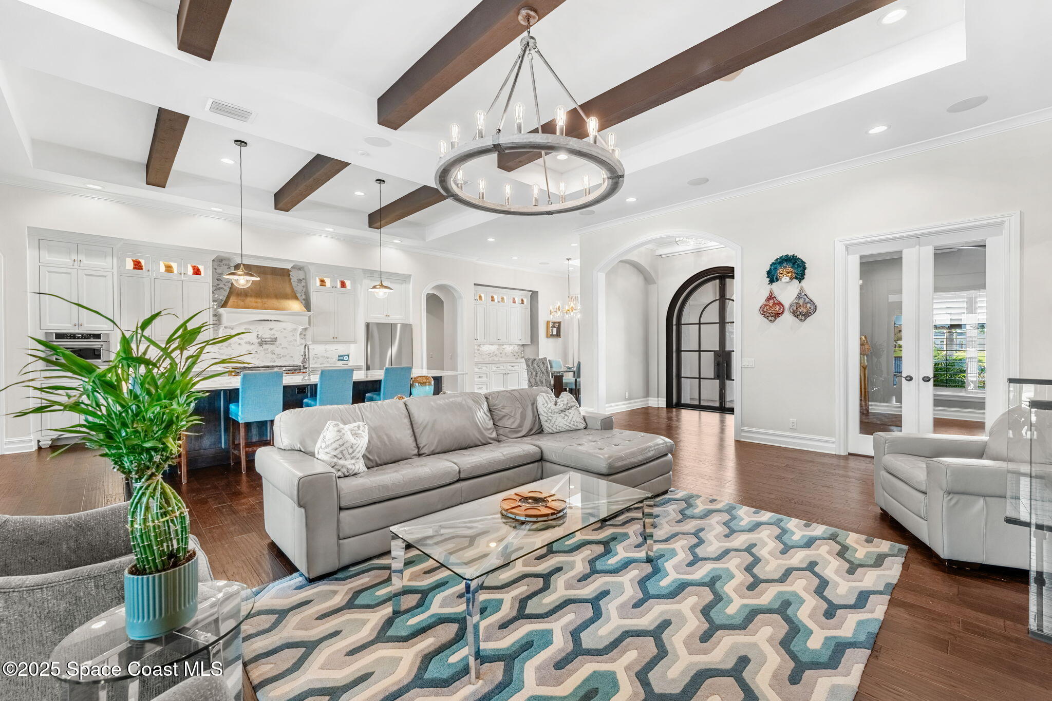 4655 Tea Tree Court Rockledge, FL 32955 - Photo 9 of 58 a living room with furniture potted plant and a large window