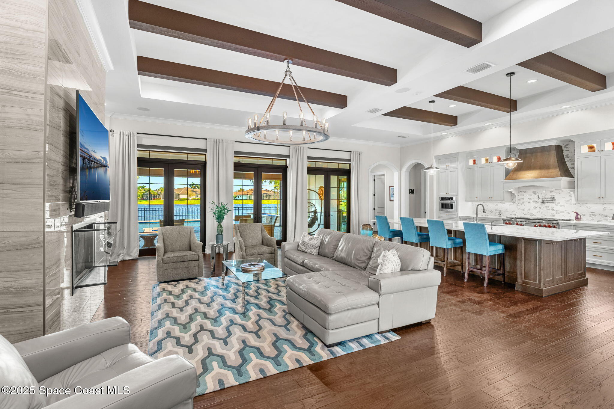 4655 Tea Tree Court Rockledge, FL 32955 - Photo 10 of 58 a living room with furniture and a flat screen tv