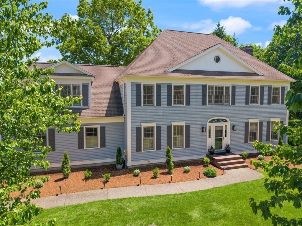 9 Bragg Road Foxboro, MA 02035 - Photo 5 of 42 a front view of a house with a garden and plants