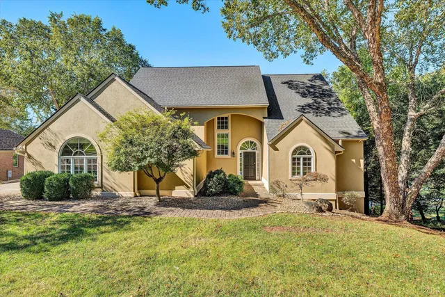a front view of a house with a yard