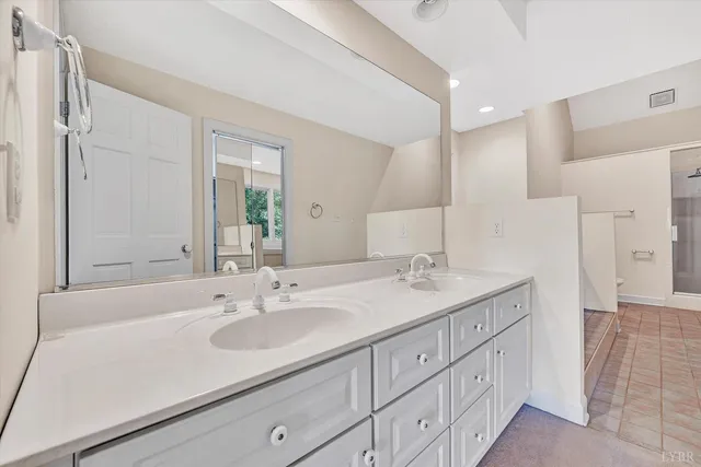 a kitchen with stainless steel appliances kitchen island granite countertop a stove a sink and a microwave