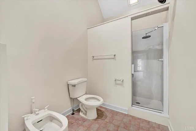 a kitchen with stainless steel appliances granite countertop a stove top oven a sink dishwasher a dining table and chairs with wooden floor