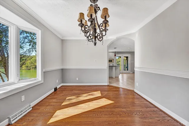 a view of an empty room and a window