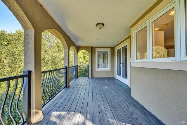 a room with furniture and potted plants