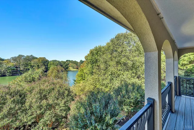 a living room with a fireplace and a potted plant