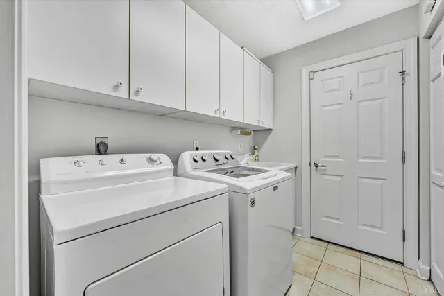 a room with furniture and pool table
