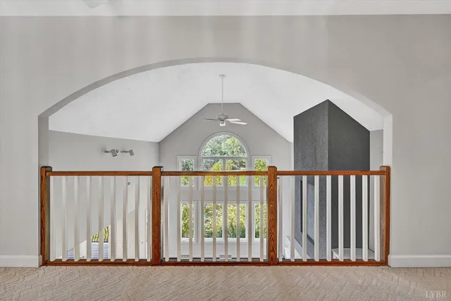 a view of a balcony with wooden floor and a front door