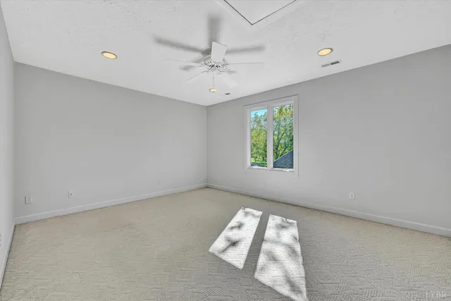 a view of a backyard with wooden fence