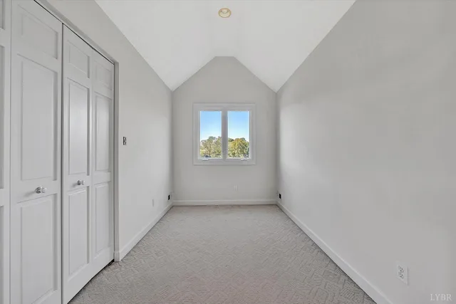 a view of a backyard with table and chairs