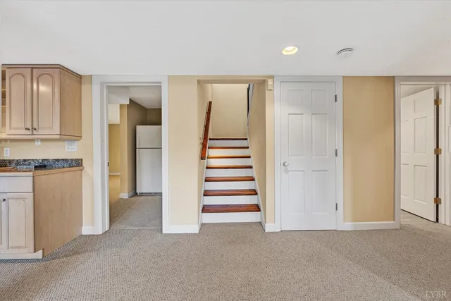 a front view of a house with trees