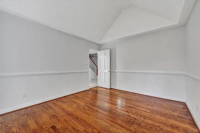 a spacious bathroom with a double vanity sink a mirror and a shower